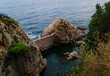 Cliffs of Cala de Sant Francesc, the coastline of the Bay of Blanes, Costa Brava, Spain. Picturesque view from above.