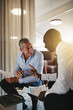 © Flamingo Images - Diverse smiling businessmen discussing a project together in an