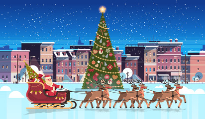 Santa claus in sleigh with reindeers near decorated fir tree city building houses night winter street cityscape merry christmas happy new year celebration concept flat horizontal vector illustration