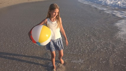 Child Playing on Beach at Sunset, Happy Kid Walking in Sea Waves Girl on Seaside