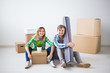 © satura_ - Relocation, real estate and moving concept - young couple people moved to a new apartment