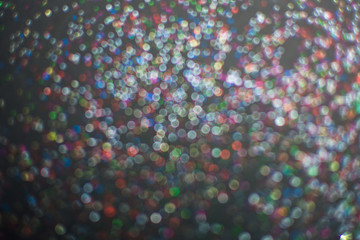 blur of glitter on black background.