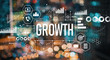© Tierney - Growth with blurred city abstract lights background
