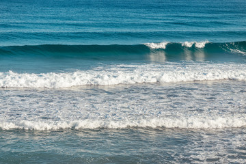 Wall Mural - Soft wave of blue ocean on sandy beach