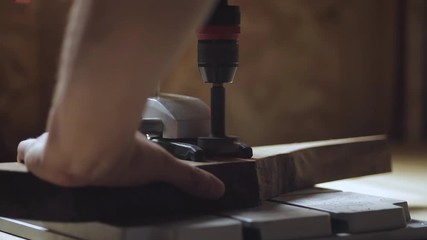 Wall Mural - Detail of a carpenters drill making hole in a piece of wood