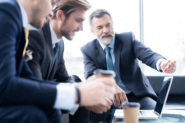 Sticker - Group of business partners discussing ideas and planning work in office.