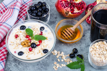 Wall Mural - Healthy delicious muesli with oatmeal and pomegranat