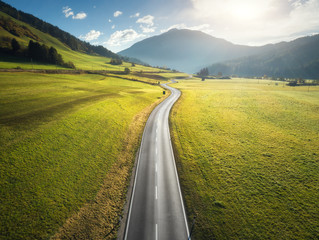 Wall Mural - aerial view of the road in mountain valley in dolomites, italy. top view of perfect asphalt roadway,