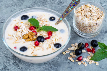 Wall Mural - Healthy delicious muesli with oatmeal and pomegranat