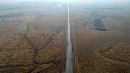 Wall Mural - Aerial view of long straight country roads