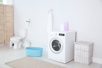 Poster - Modern washing machine in light bathroom interior