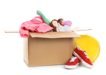 Wall Mural - Donation box, shoes, clothes and toys on white background. Space for text