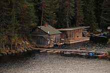 Dilapidated Wooden Hut On The Lake