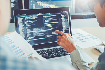 Wall Mural - developing programmer team development website design and coding technologies working in software co