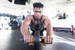Healthy African American Man working on core strength in gym