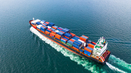 Aerial view cargo container ship sailing, container cargo ship in import export and business logistic and transportation of international by container ship in the open sea.