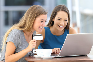 Poster - Friends paying on line with credit card in a bar