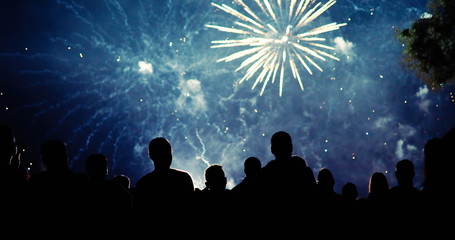 Wall Mural - Crowd watching fireworks and celebrating new year eve