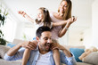 © NDABCREATIVITY - Happy family having fun time at home