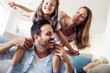 © NDABCREATIVITY - Happy family having fun time at home