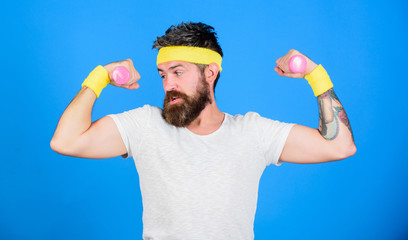 Join my sport class. Sportsman retro outfit training blue background. Athlete training with cute dumbbell. Man bearded athlete exercising dumbbell. If you want to be strong. Motivated athlete guy