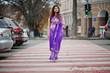 © AS Photo Family - Indian hindu girl at traditional violet saree posed at street , walking at pedestrian crossing.