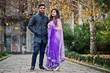 © AS Photo Family - Stylish indian hindu couple posed on street.