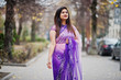 © AS Photo Family - Indian hindu girl at traditional violet saree posed at autumn street.