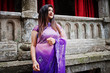 © AS Photo Family - Indian hindu girl at traditional violet saree posed at  street against old house with red curtains.