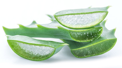 Wall Mural - Aloe or Aloe vera fresh leaves and slices on white background.