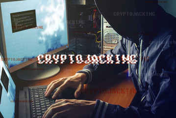 Wall Mural - Anonymous hacker without a face is trying to steal cryptocurrency using a computer. Fraud and deception at Cryptojacking