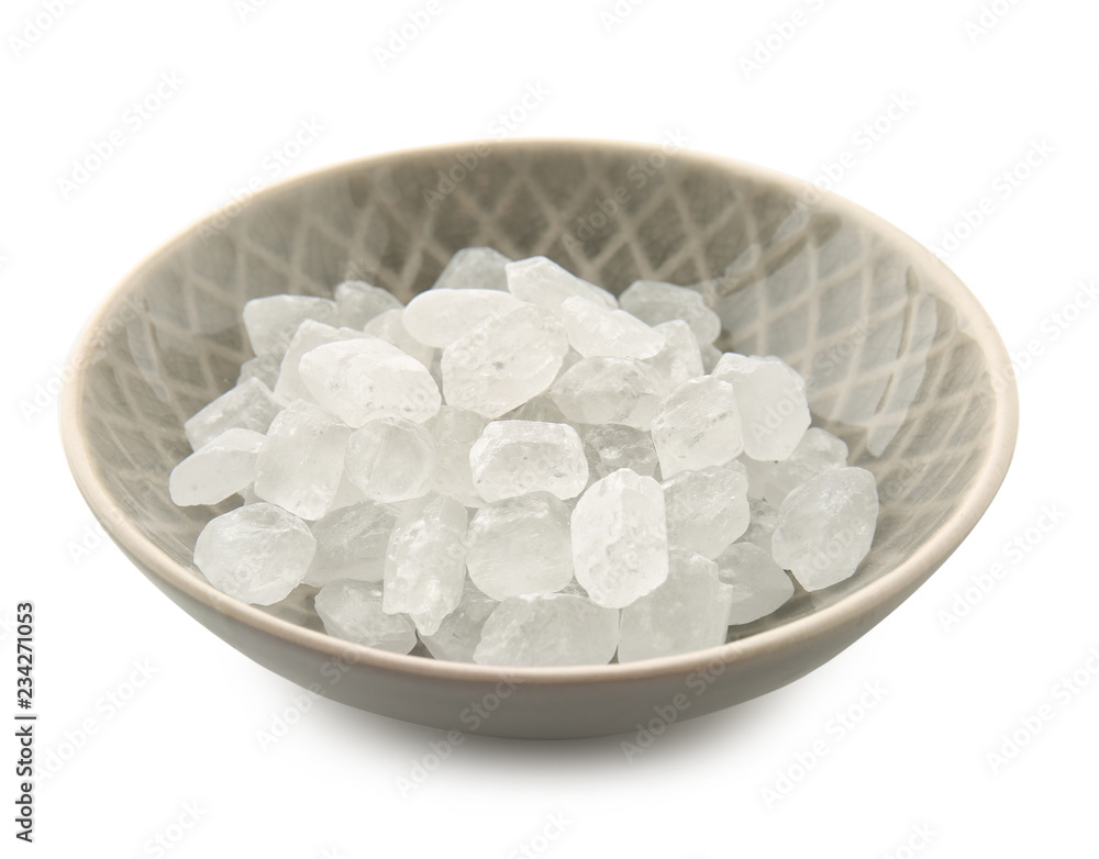 Bowl with sugar on white background