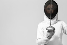Young Fencer Athlete Wearing Fencing Costume Holding The Sword And Mask. Isolated On White Background