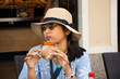 Travelers thai woman travel visit and sitting eat sandwiches at local restaurant in Heidelberg old town of Baden-Wurttemberg, Germany