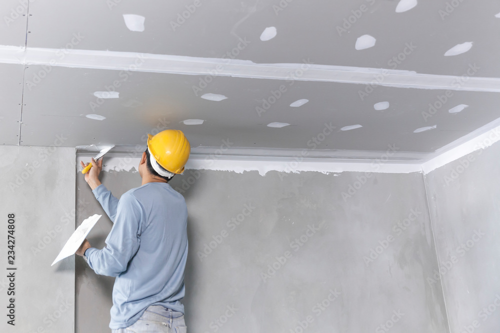 Craftsman working with plaster gypsum ceiling for interior build gypsum board ceiling - obrazy, fototapety, plakaty 