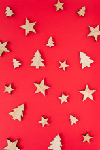 Christmas Or New Year Decorations ( Stars And Trees Made Of Wood ) On Red Background
