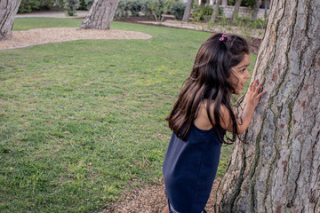 Girl playing in a park outdoors.