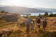 © Monkey Business - Rear View Of Multi Generation Family Walking On Top Of Hill On Hike Through Countryside In Lake District UK