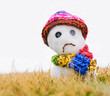 Sad snowman with hat and scarf