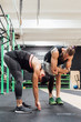 © Eugenio Marongiu - young man and woman training toghether indoor gym - crossfit, sportive, training concept