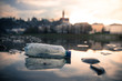 © Patrick Daxenbichler - Environmental pollution: plastic bottle on the beach, urban city