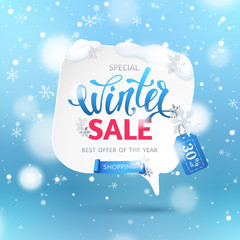 Wall Mural - Winter sale banner with paper speech bubble, ribbon, snowflakes and text. Blue background with snowfall and hanging tag for design of flyers with discount offers and special seasonal retail promotion.