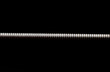Extreme macro shot of a guitar string isolated on black (shallow DOF, selective focus)