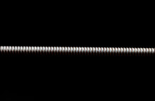 Extreme Macro Shot Of A Guitar String Isolated On Black (shallow DOF, Selective Focus)