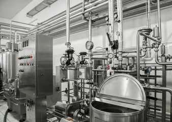 Wall Mural - electronic control panel and tank at a milk factory. equipment at the dairy plant