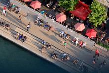Aerial View Of People Sitting And Walking On The Chicago Riverwalk In A Sunny Summer Day