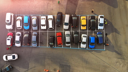 Aerial. Little city parking lot with colorful cars. Transportation background.