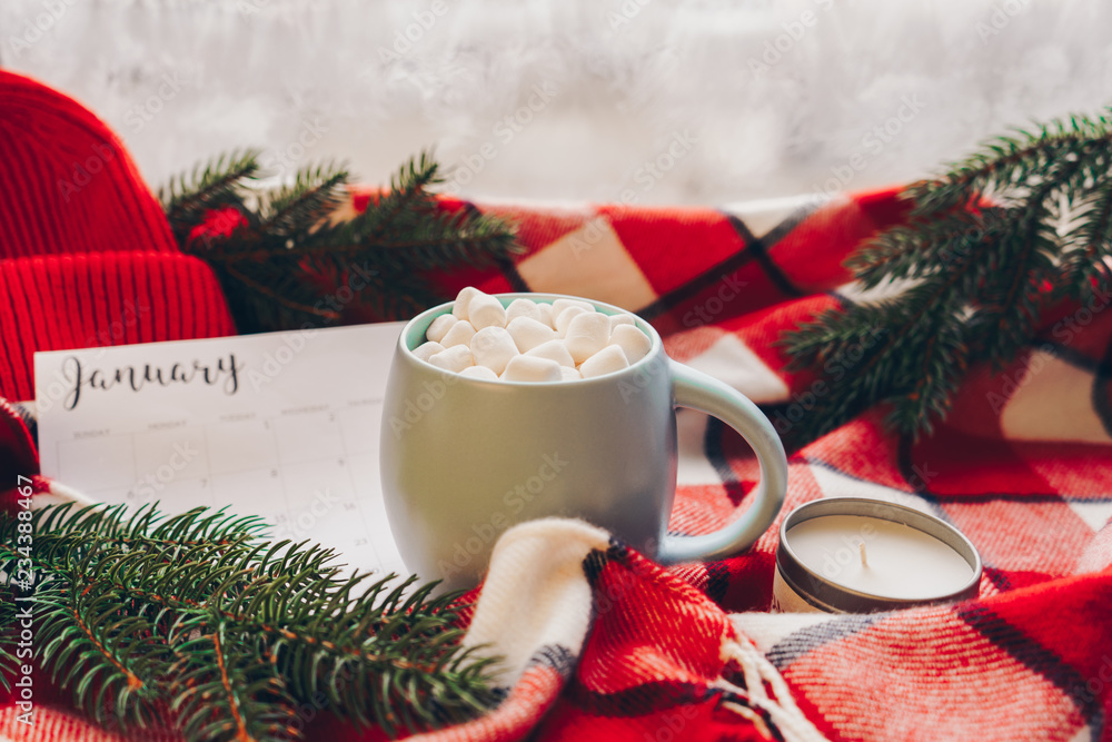 Calendar January month. Christmas concept. Coffee cup with marshmellow and holiday decoration. - obrazy, fototapety, plakaty 