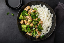 Teriyaki Chicken And Broccoli With Steamed Rice In Bowl