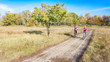 © Iuliia Sokolovska - Family on bikes autumn cycling outdoors, active mother and kid on bicycles, aerial view of happy family with child in fall park from above, sport and fitness concept